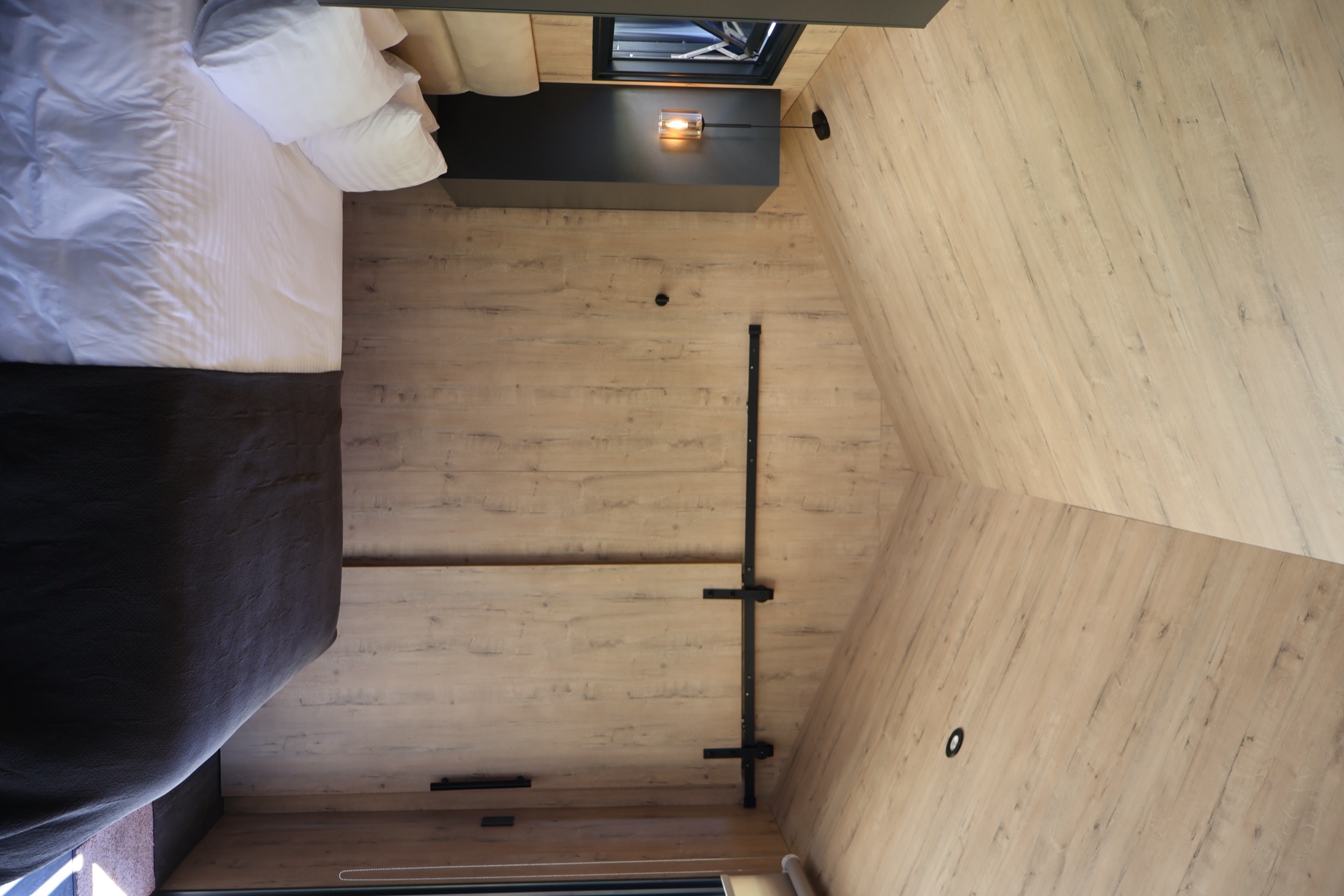Bedroom view towards the open door and ambient light