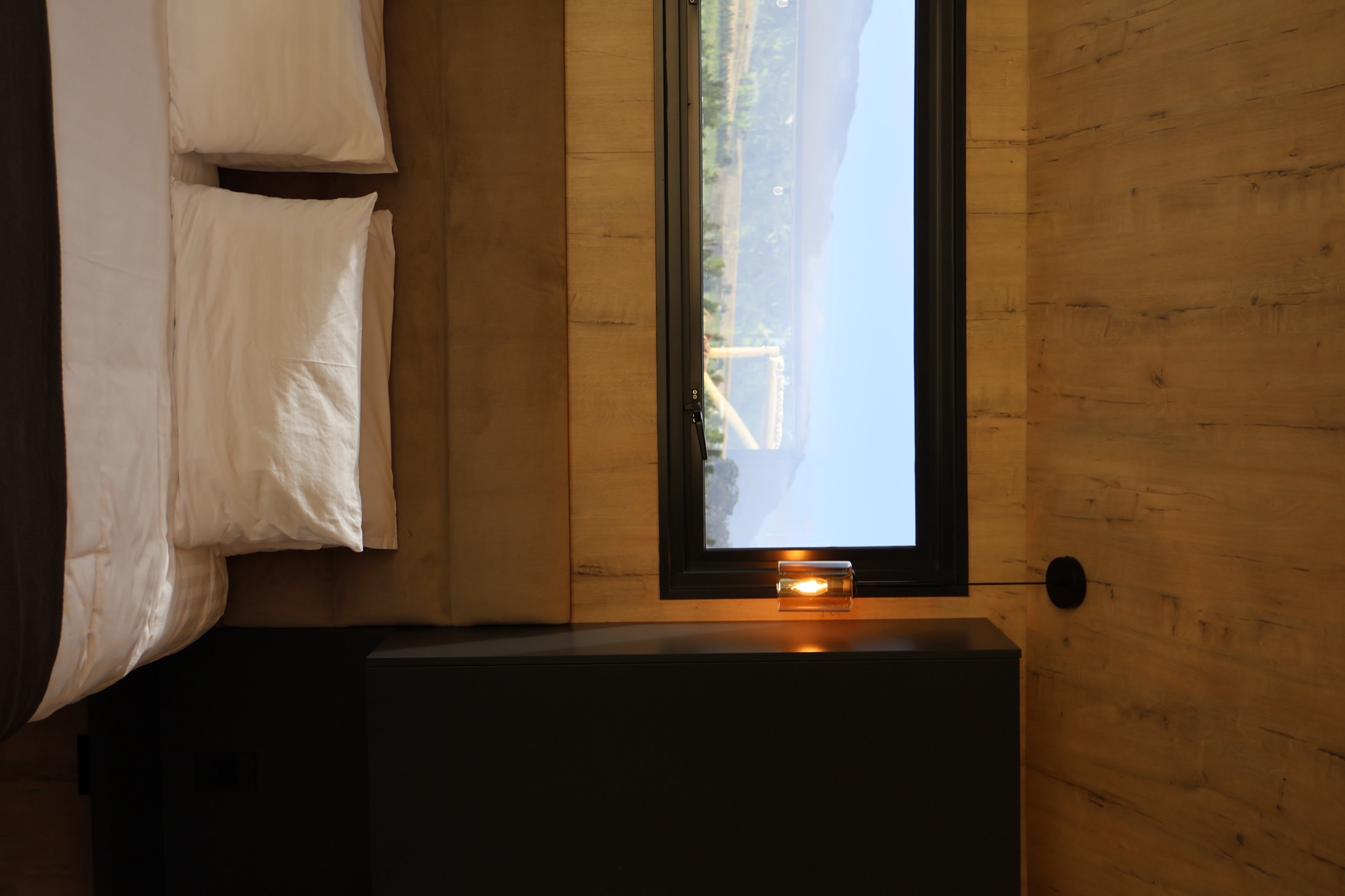 Comfortable queen-sized bed with plush bedding