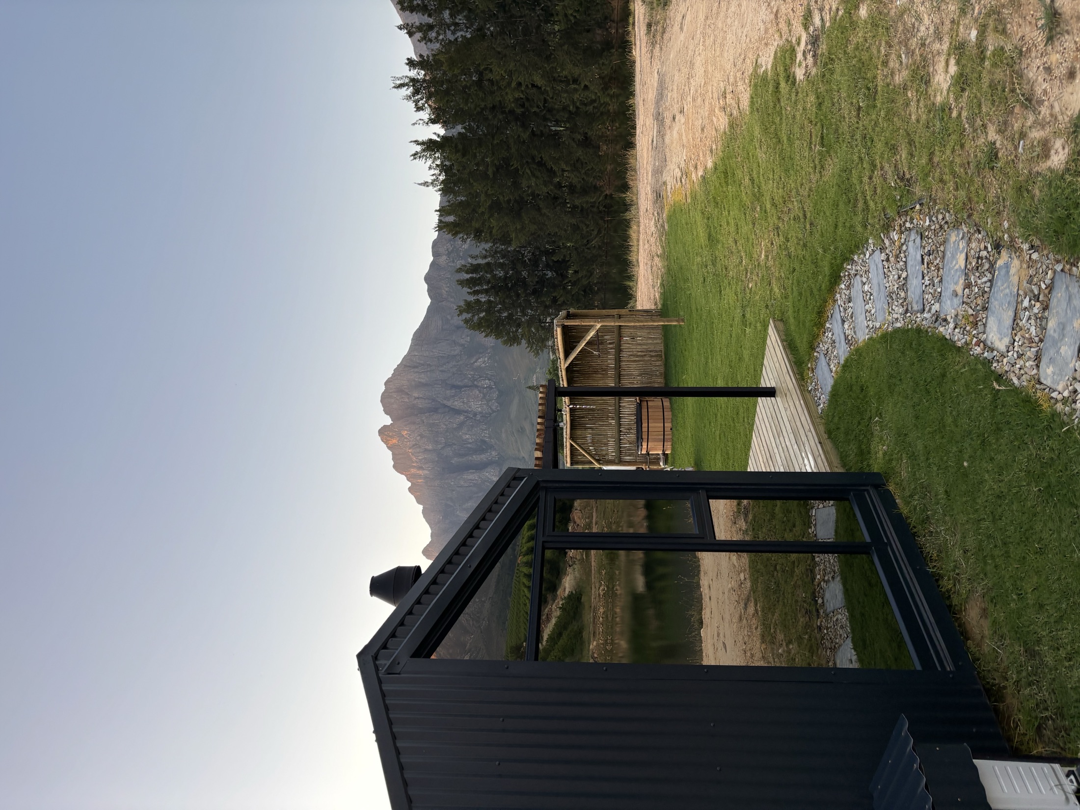 Cosy interior of Werda Cabin looking out over the valley